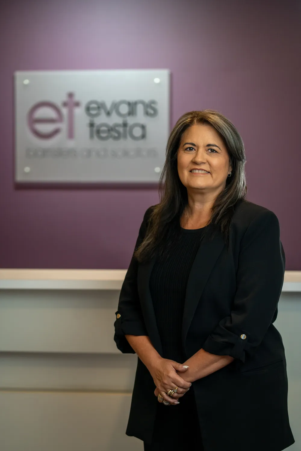 Lauri Evans in front of ET Law signage